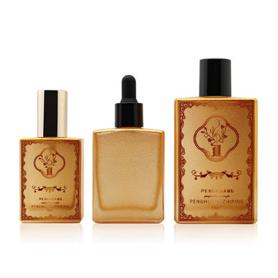 Garrafa de vidro personalizada do conta-gotas do óleo essencial do soro luxuoso vazio cosmético do quadrado do ouro do óleo 30ml 50ml 100ml