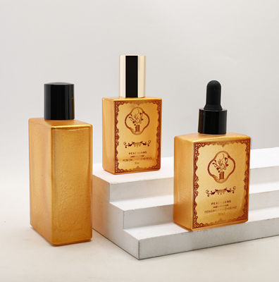 Garrafa de vidro personalizada do conta-gotas do óleo essencial do soro luxuoso vazio cosmético do quadrado do ouro do óleo 30ml 50ml 100ml
